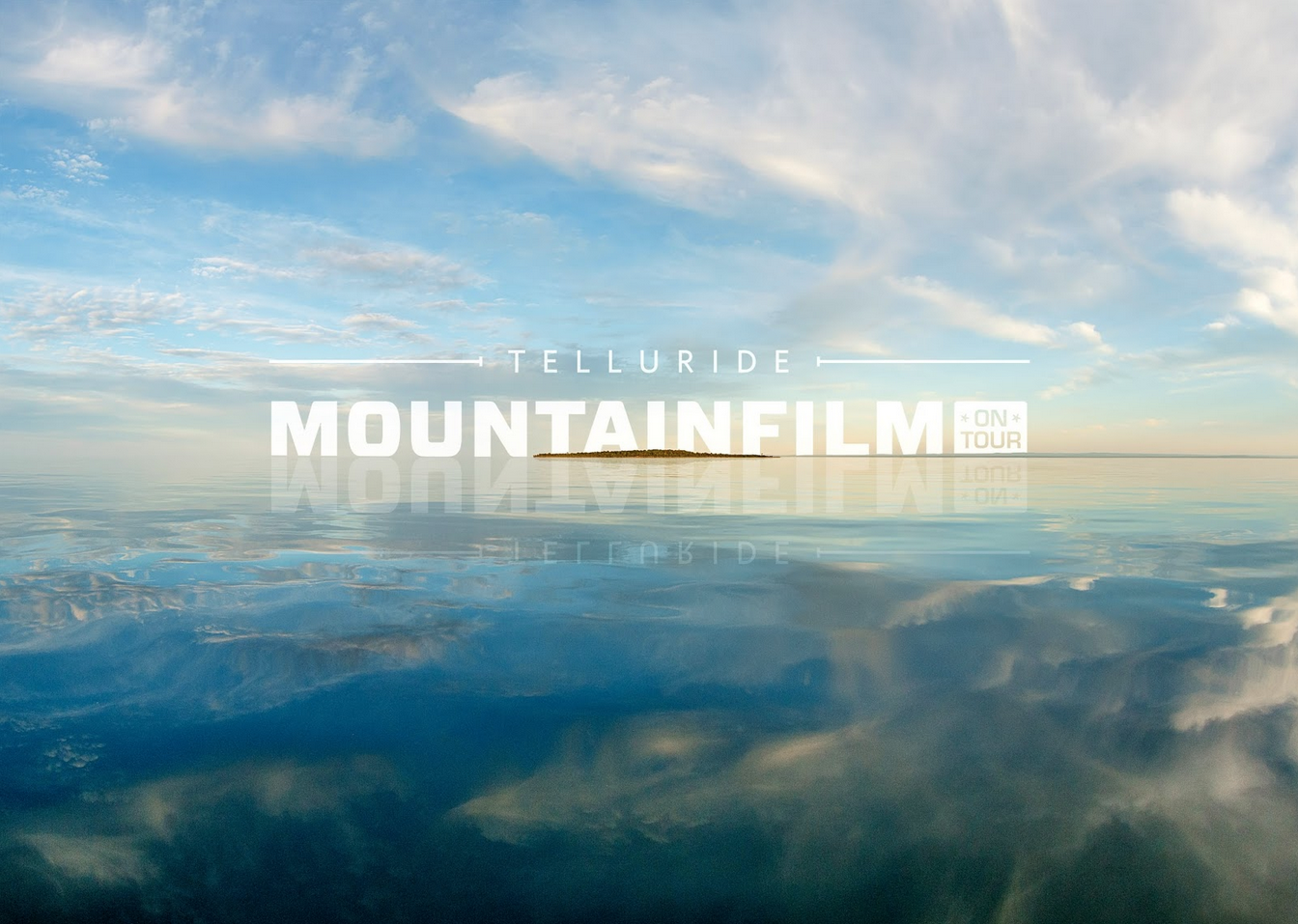 Sky reflecting on water with remote island. Telluride Mountain Film 2015