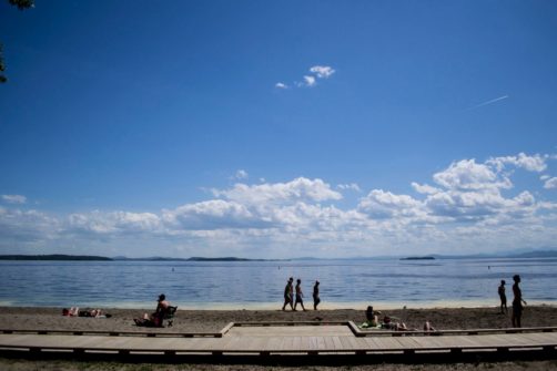people walking along the beach