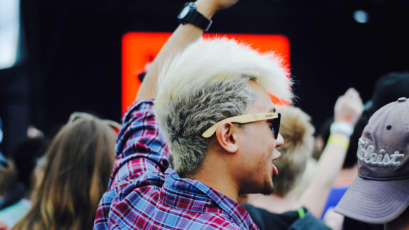 student pumping their fist to music