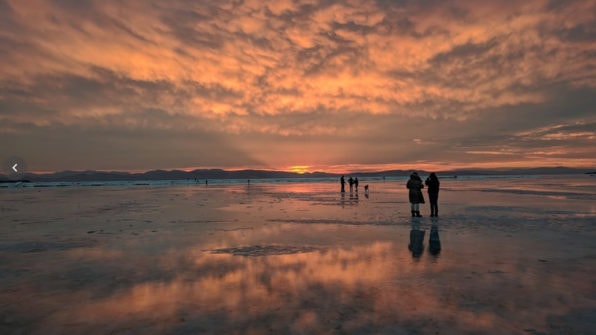 sunset at an icy waterfront