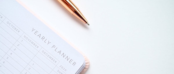 a planner and a pen