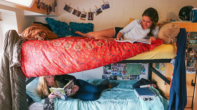 students laying on bunk beds