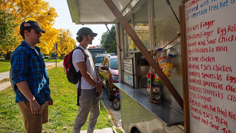 students ordering at a food truck