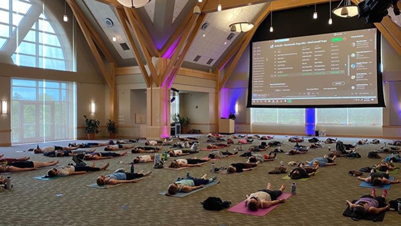 Students doing yoga in the davis center distanced