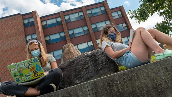 students studying at amphitheater