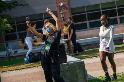 a student taking a selfie at the annual club fair