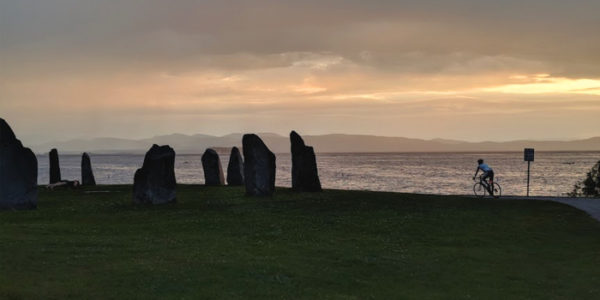 sunset over lake champlain with the earth clock in the foreground