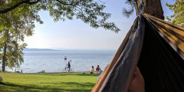 a hammock hanging with lake champlain in the background