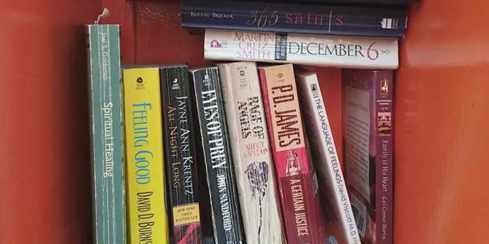 a stack of books in a small cubby