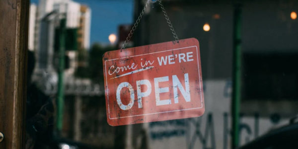 a shopping sign that says yes we're open