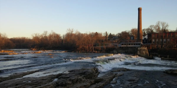the winooski river with some old factories along the edge