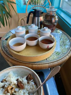 three tea cups with a sweet rice bowl