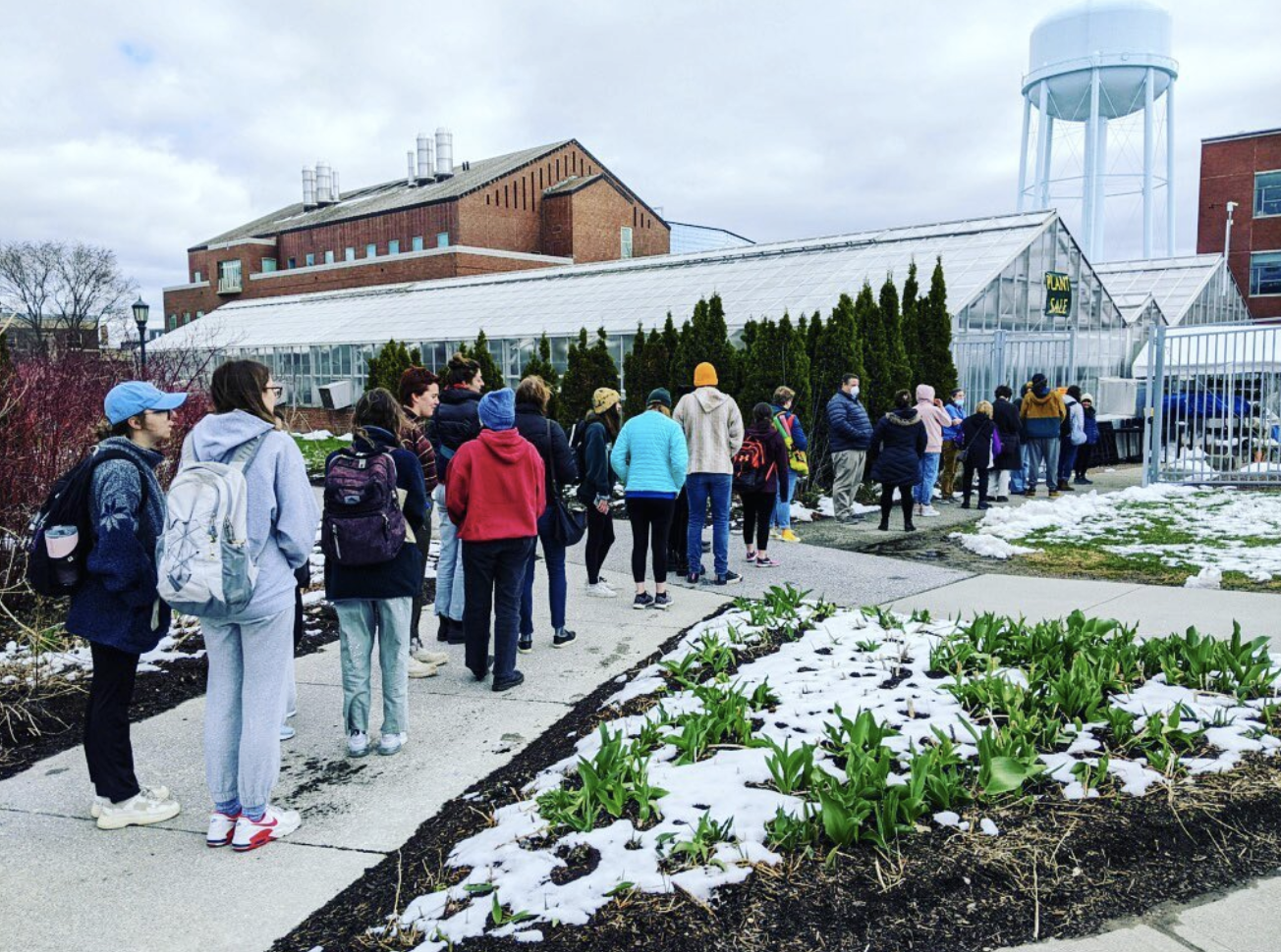 people lined up at the greenhouse