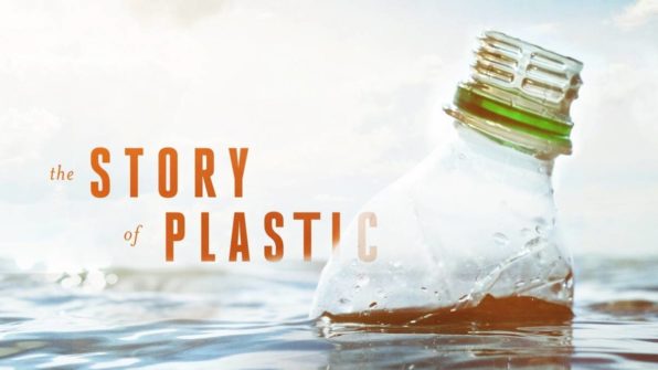 A crushed plastic water bottle floats in a body of water