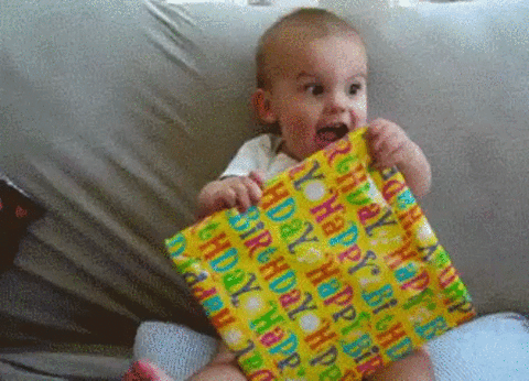 baby excited about receiving a gift