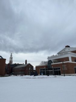outside of the flemming museum with a snow-covered ground and a grey sky