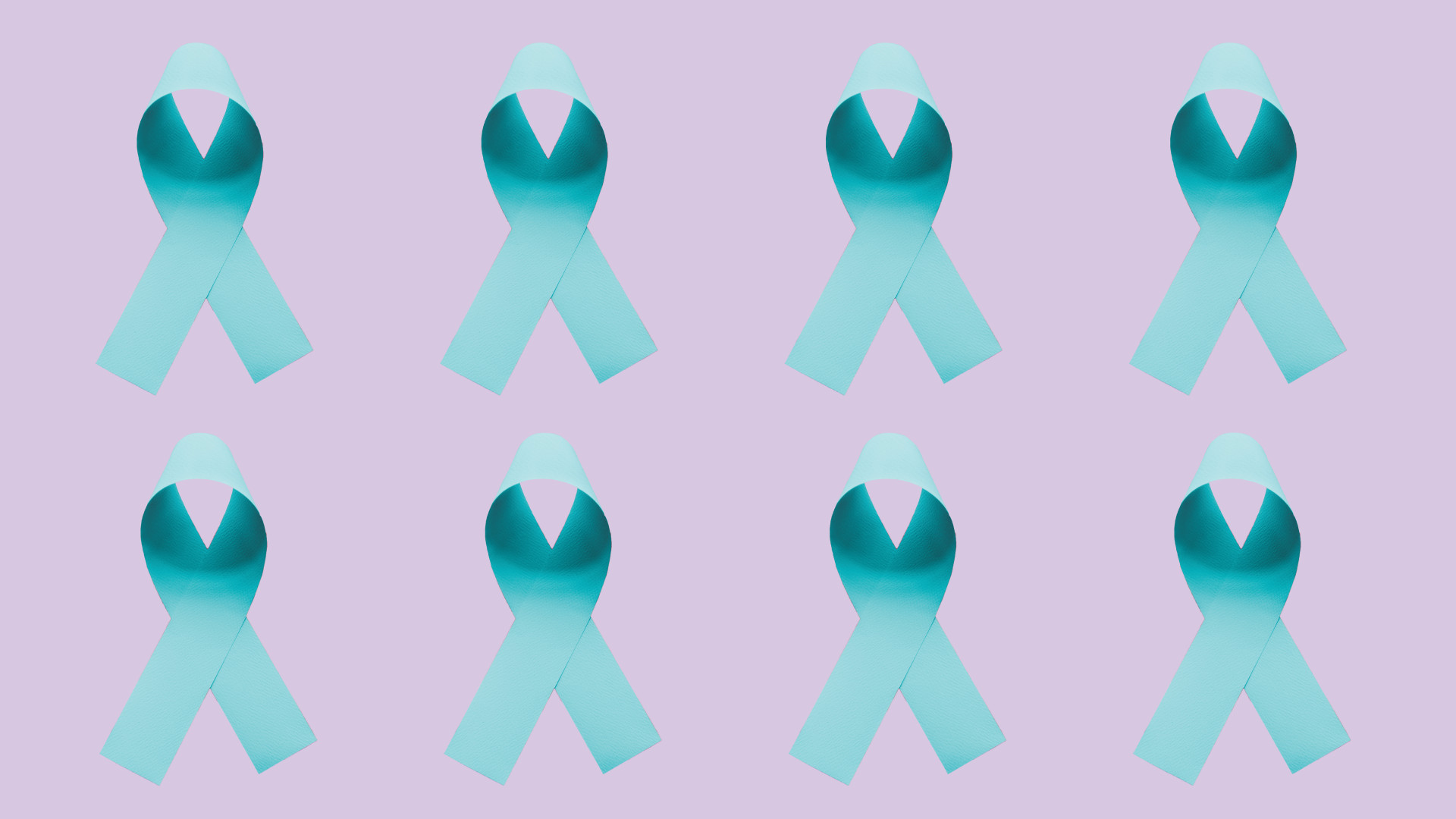 A pattern of teal ribbons against a purple background