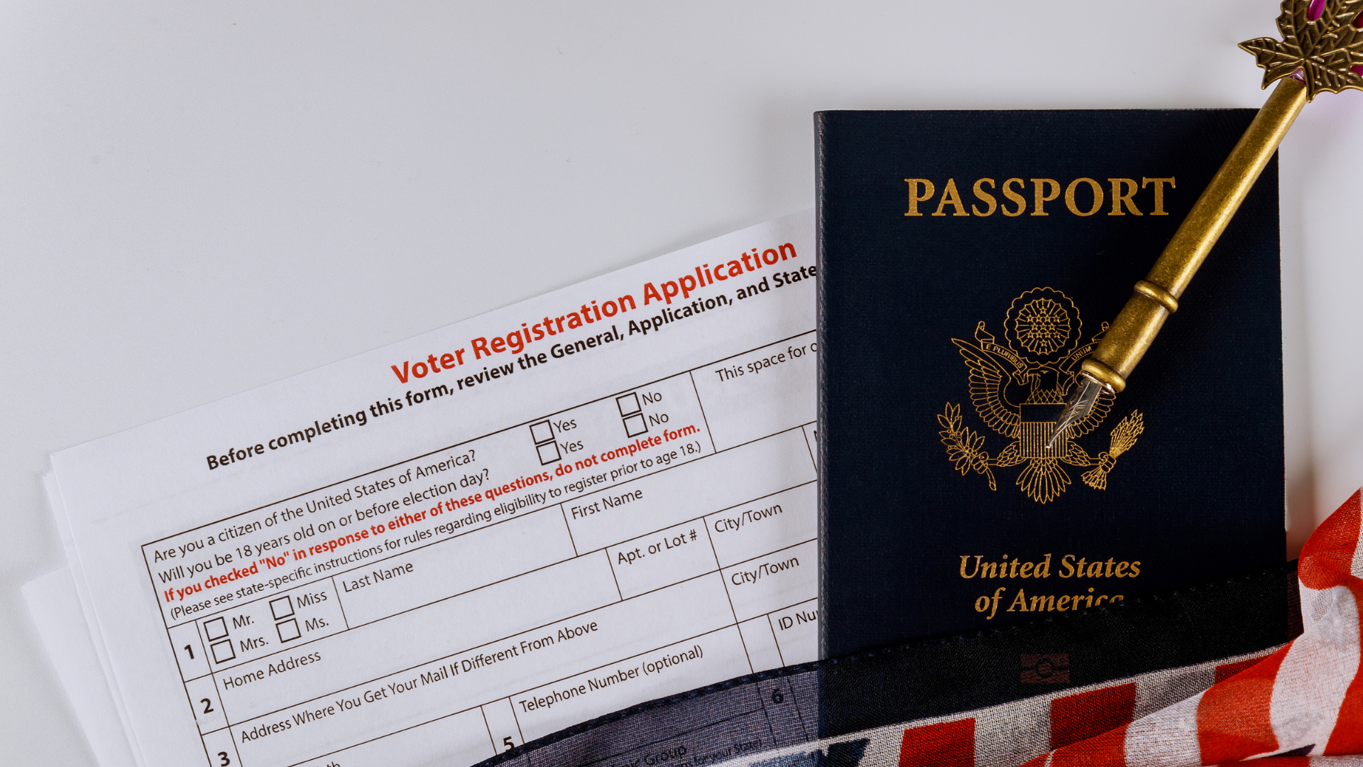 an American passport on top on a voter registration form
