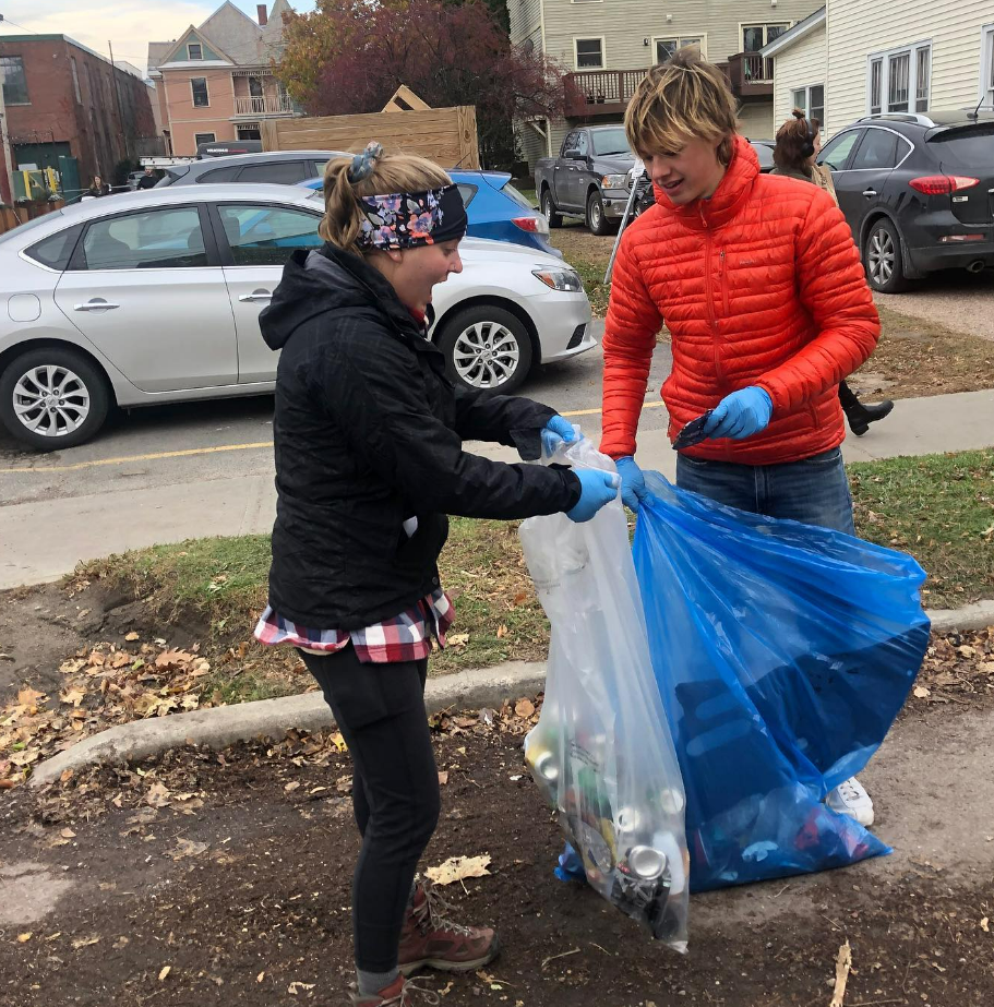 Two UVM students picking up waste in downtown Burlington.