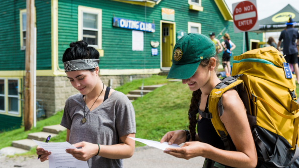 two people looking at maps