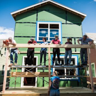 Volunteers on a construction site as they help build a home in Burlington in partnership with Habitat for Humanity.