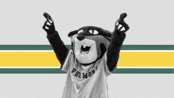 UVM's mascot, Rally Cat, raises its arms in a cheer against a green and gold background
