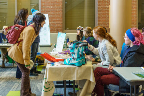 Photo of students tabling at winter activities fest in the Davis center atrium