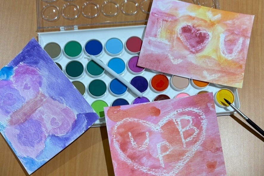 Various art supplies and paints on a table